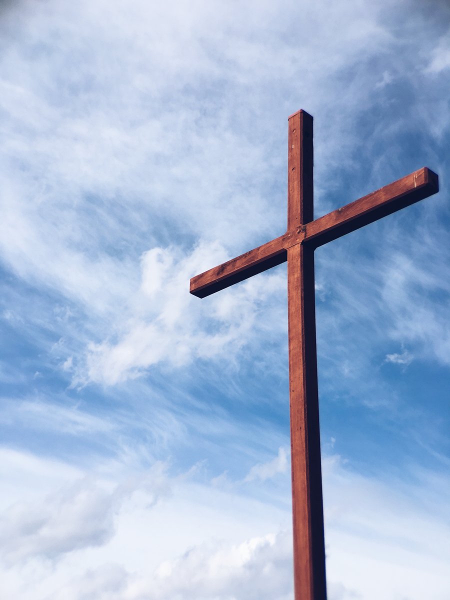 a wooden cross against the sky, used symbolically for the crucifixion.