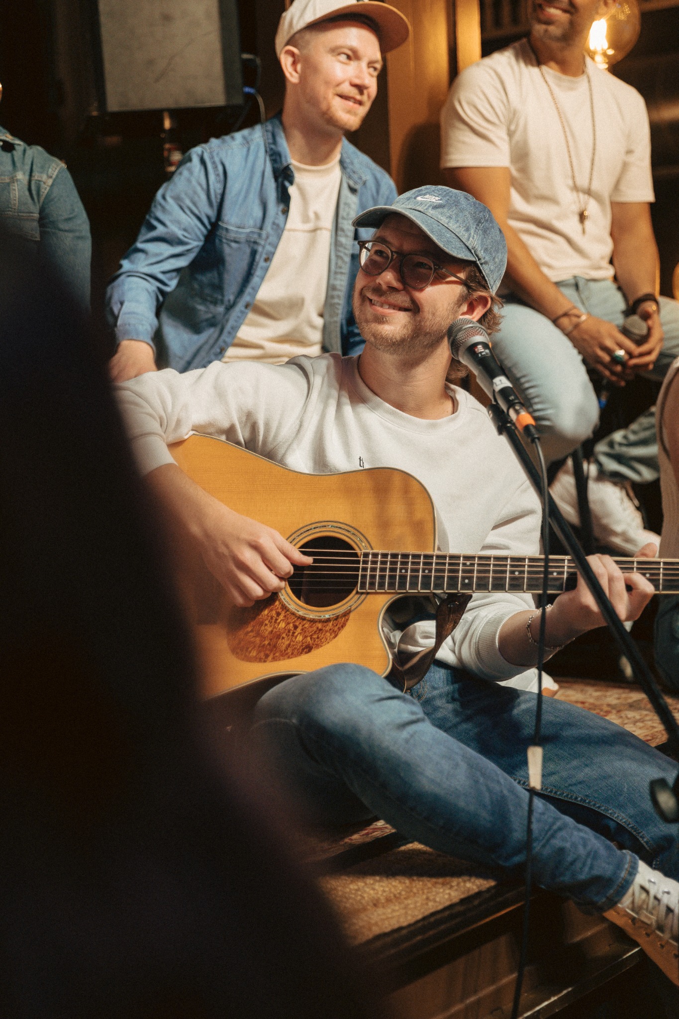 friends sharing a song on acoustic guitar